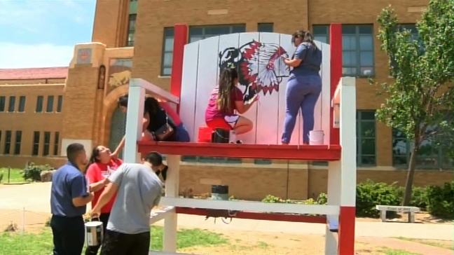 Wichita North High School students erase the work of vandals