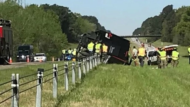 GSP: Bus headed to Masters flips on highway; Driver charged with DUI