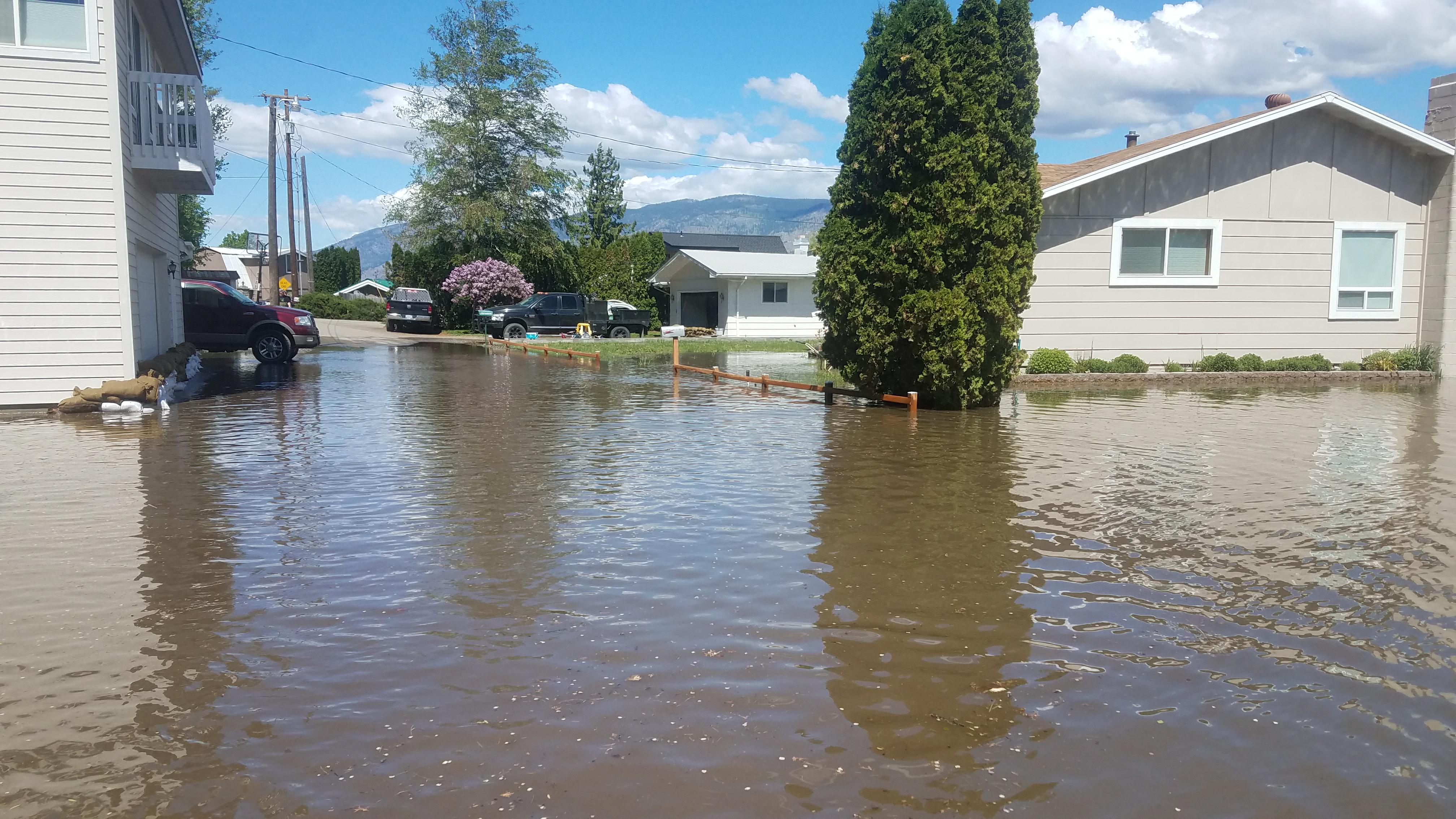 Rapidly melting snow causes flooding in Okanogan County forcing dozens