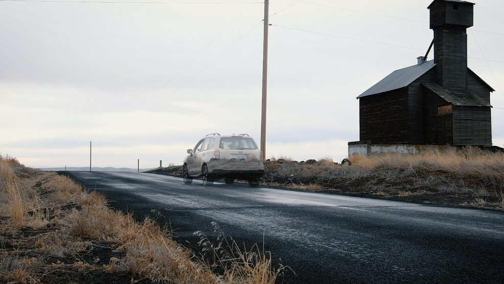 Cars seemingly roll uphill by themselves on Gravity Hill outside